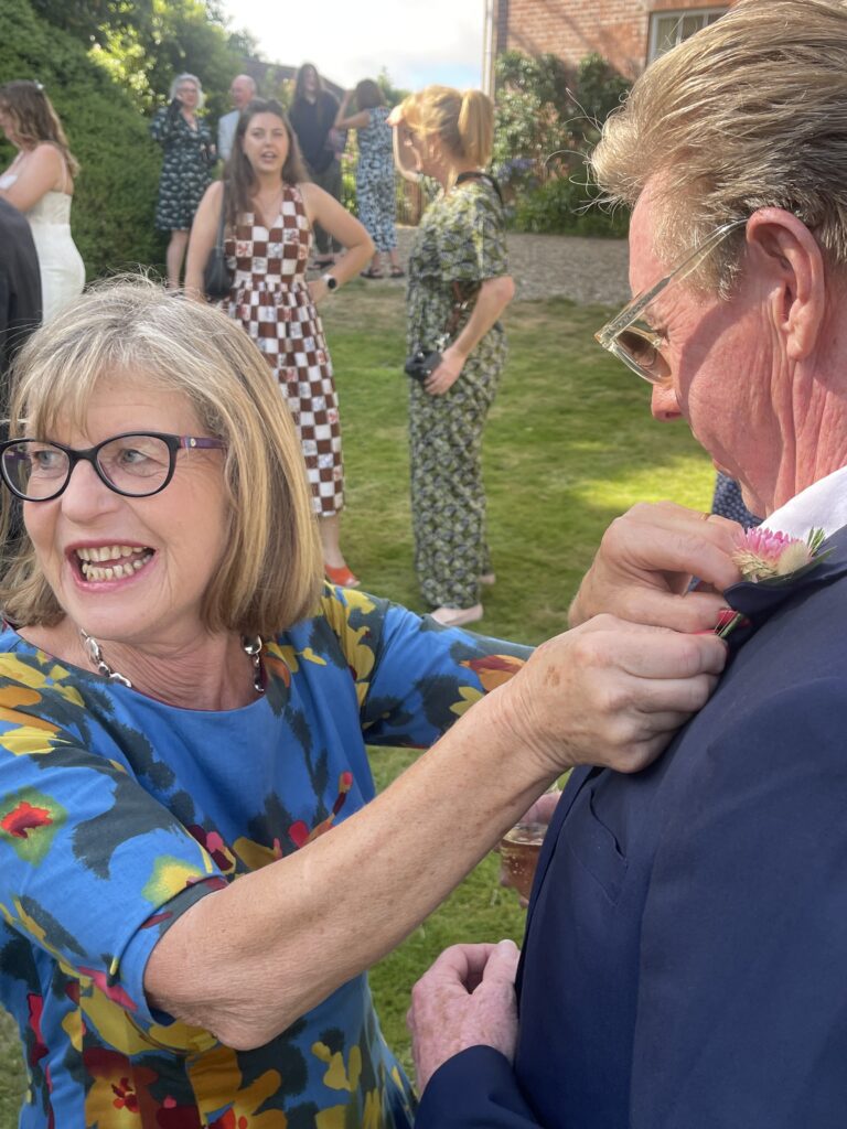 Sarah adjusting a buttonhole!